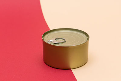 High angle view of coffee cup against red background