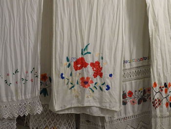 Clothes hanging on white wall at home