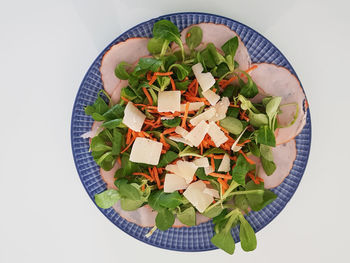 High angle view of chopped vegetables in bowl on table