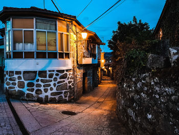 Street amidst buildings against sky