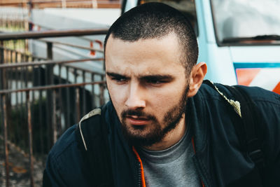 Portrait of young man in car