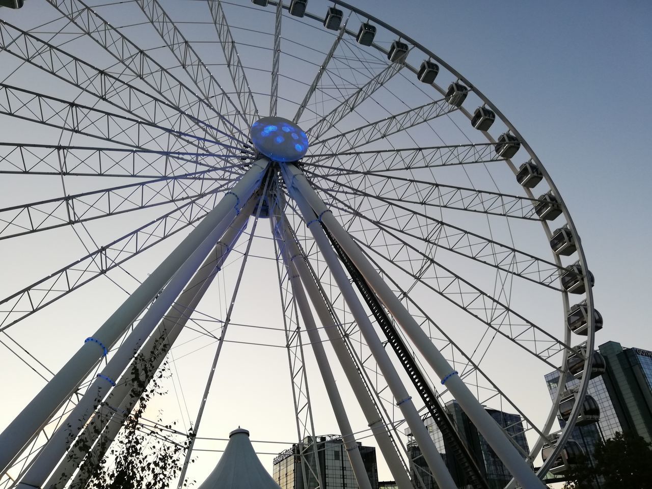 LOW ANGLE VIEW OF FERRIS WHEEL AGAINST THE SKY