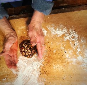 High angle view of person preparing food on table