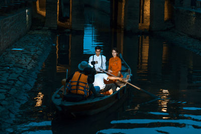 Men in boat against sea