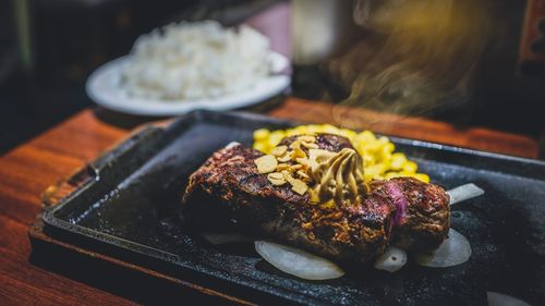 Close-up of steak served on table