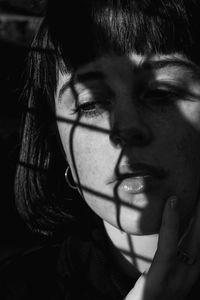 Close-up portrait of woman looking away