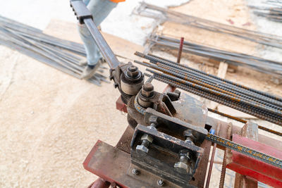 Worker using steel bending rebar self lever for building equipment