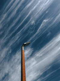 Low angle view of bird flying against sky