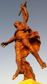 Low angle view of statue against sky