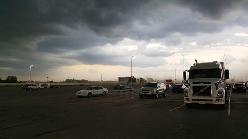 Cars on road against sky