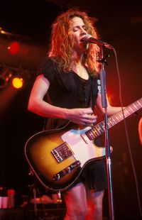 Young woman playing guitar