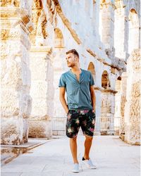 Man walking against historic building in city