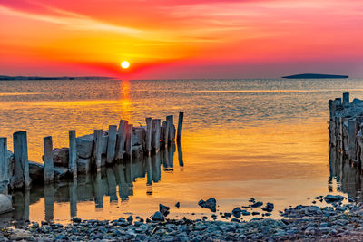 Scenic view of sea against sky during sunset