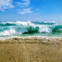 Scenic view of sea against blue sky