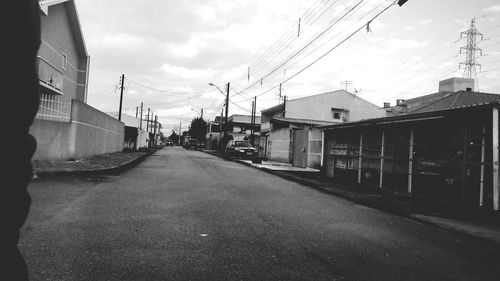 City street against cloudy sky