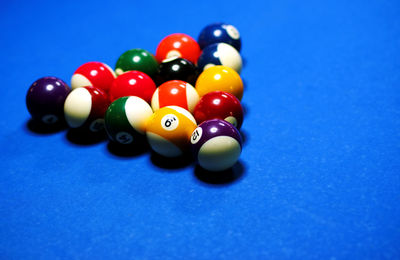 Pool balls arranged on blue table