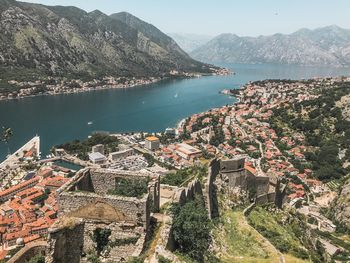 High angle view of townscape by sea