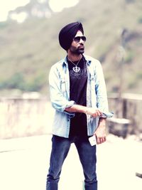 Man wearing turban standing on terrace