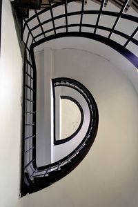 Directly below shot of spiral staircase of building