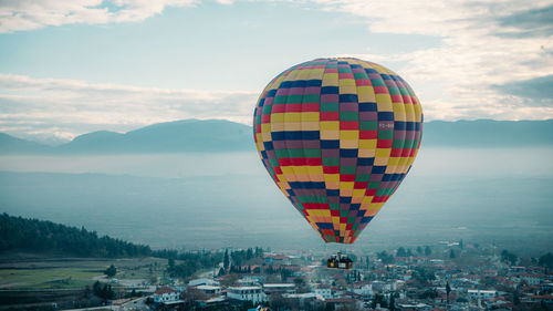 Low angle view of hot air balloons against sky