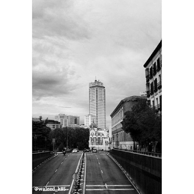 building exterior, architecture, built structure, city, transfer print, sky, skyscraper, auto post production filter, tower, office building, tall - high, transportation, car, modern, building, road, street, city life, glass - material, the way forward