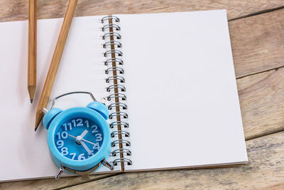 High angle view of clock on table