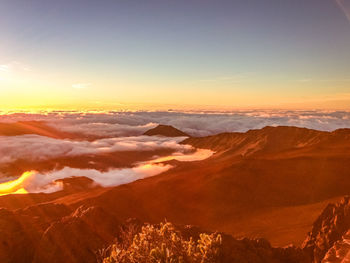 Scenic view of mountains against sky during sunset