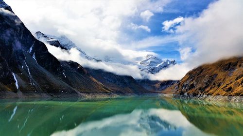 Scenic view of lake and mountains against sky