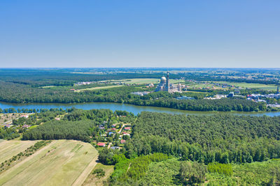 High angle view of trees and buildings against clear sky