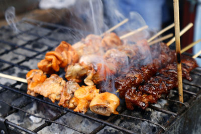 Close-up of meat on barbecue grill