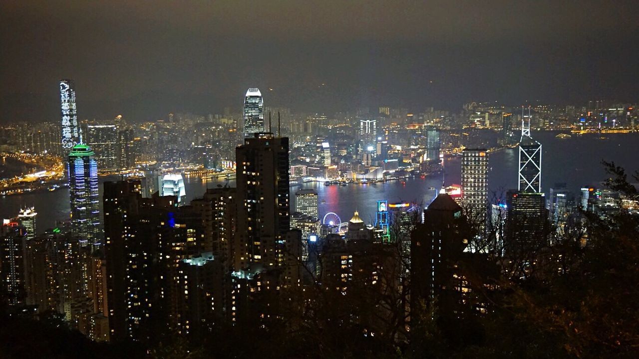 VIEW OF ILLUMINATED CITYSCAPE AT NIGHT