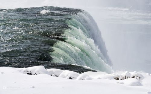 Scenic view of sea waves splashing in winter