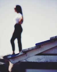 Low angle view of man against clear sky