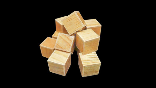 Close-up of wooden blocks black background