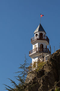 Low angle view of tower against clear blue sky