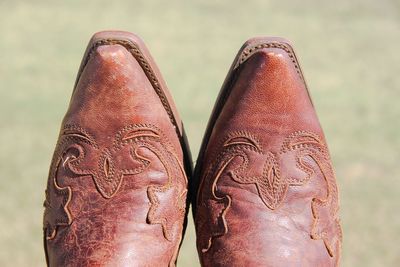 Close-up of shoes on sunny day