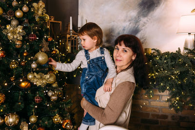 Grandmother and little granddaughter spend time together at christmas time.