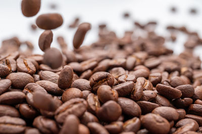 Close-up of coffee beans on table