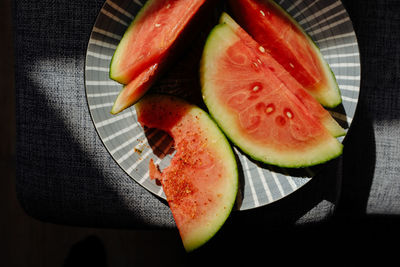 High angle view of melon in plate on table