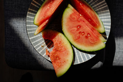 High angle view of fruits in plate on table