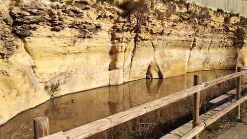 Scenic view of rock formation by water