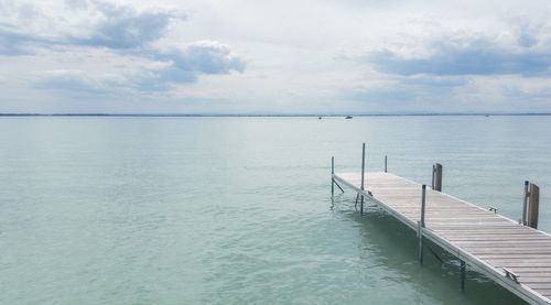 Scenic view of sea against cloudy sky