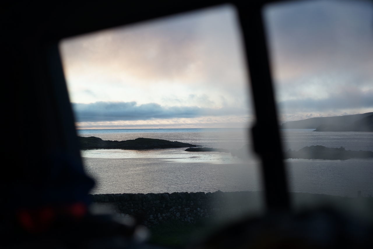 SEA SEEN THROUGH WINDOW