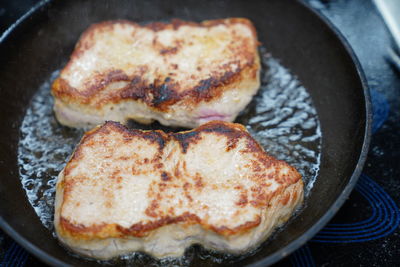 High angle view of meat in cooking pan