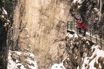 High angle view of man on snow covered mountain