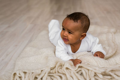 Cute boy lying on bed