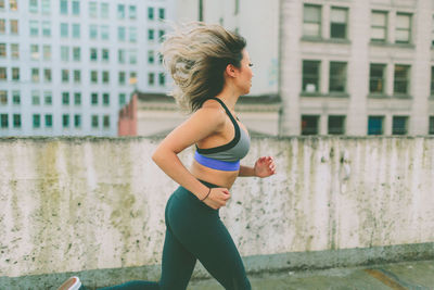 Woman running in city