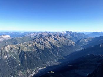 Scenic view of mountains against clear blue sky