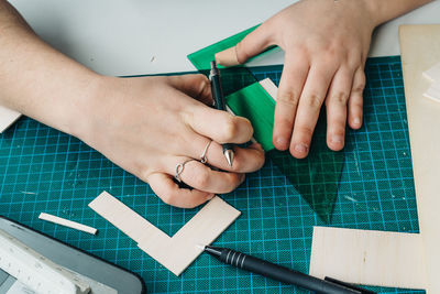 Midsection of woman working on tiled floor