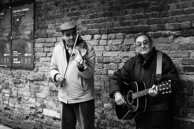 Men playing guitar